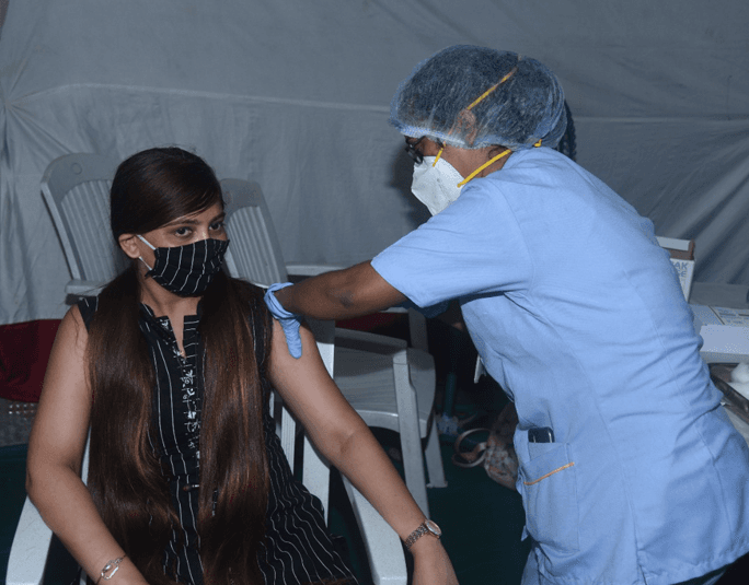 A healthcare professional administering a vaccination